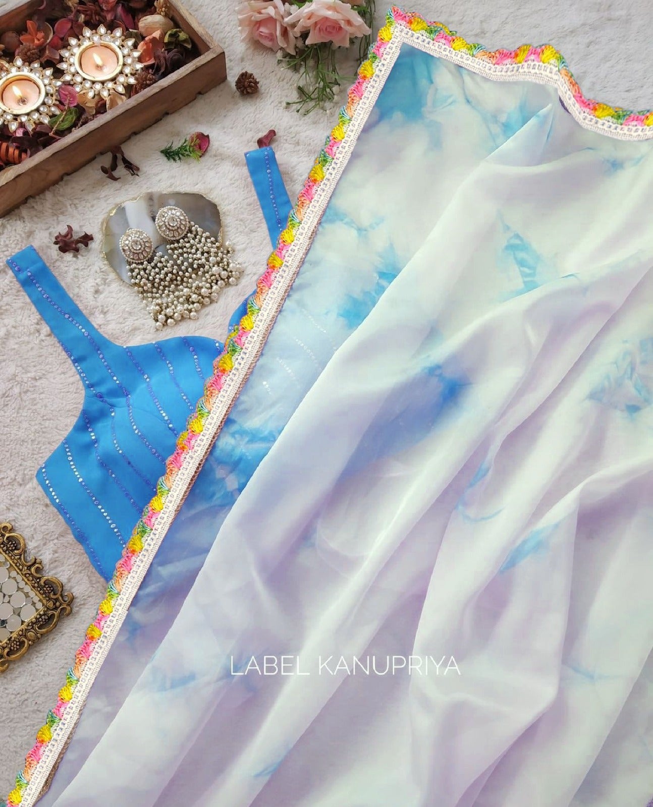 Blue Organza saree with Art silk Blouse